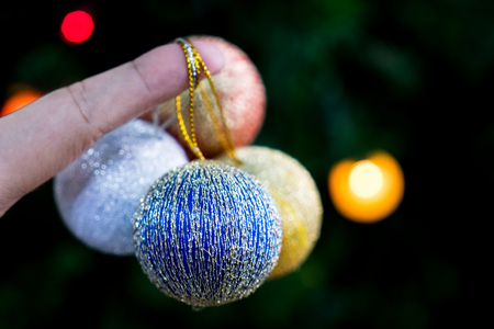 christmas ball and fingerの写真素材