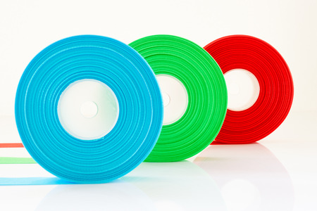 Red Green Blue ribbon Roll isolated on white backgroundの写真素材