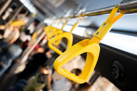 Handle on ceiling of bus,handle on a trainの写真素材