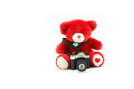 red bear doll with camera toy isolated on white