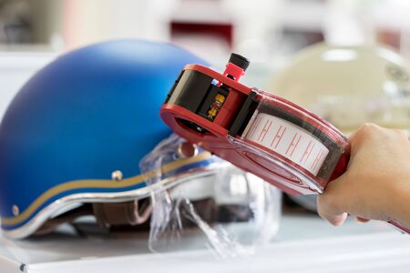 Hand holding shop pricing gunの写真素材