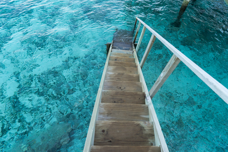 wood stair into the seaの写真素材