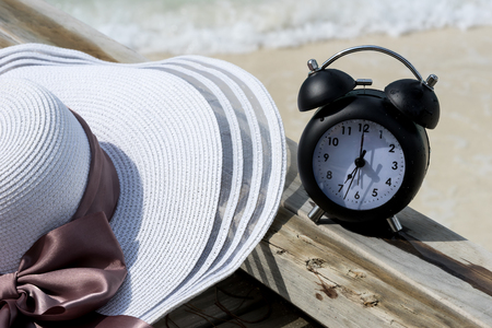 classic clock and hat on the bridge at the sea , Maldives