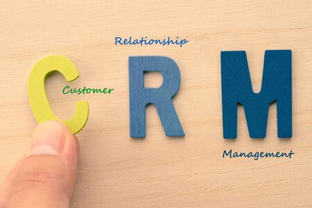 Hand arrange letters as CRM (Customer , Relationship , Management)の写真素材