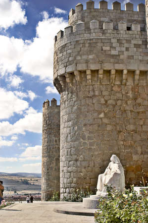 Sacred Teresa's monument at a wall of the city of Avilaの写真素材