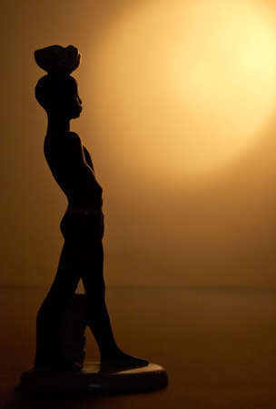 Small porcelain sculpture of the African boy.の写真素材