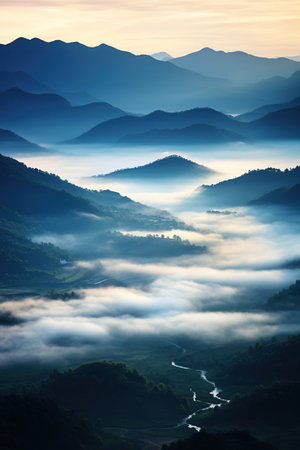 Foggy morning in the mountains. Beautiful landscape with mountains and riverの素材