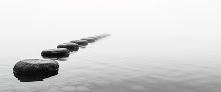 Black and white zen stones in calm water, panoramic bannerの素材