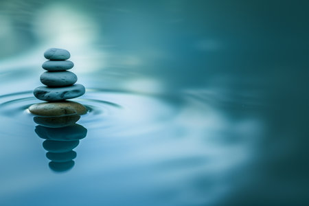 zen stones in water with ripples and blue background, zen conceptの素材