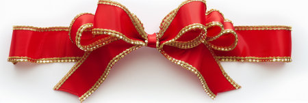 Red ribbon bow isolated on white background for Christmas and New Year.の素材
