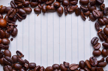 Coffee beans on paper for notesの写真素材