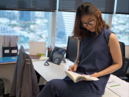 Beautiful woman reading bookの写真素材