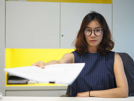 Unhappy woman boss working in the officeの写真素材