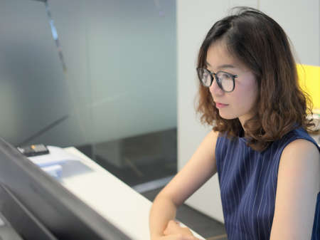 Glamour working woman in the officeの写真素材