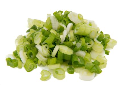 isolated closeup chopped scallions on white backgroundの写真素材
