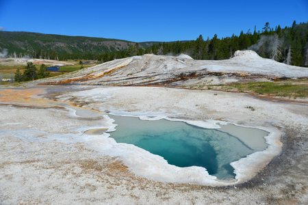 Hot geyser pool in Old Faithful area of Yellowstone National Parkの写真素材