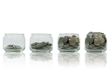 Money growing step with deposit coin, Saving money in jar, Money isolated on white backgroundの写真素材