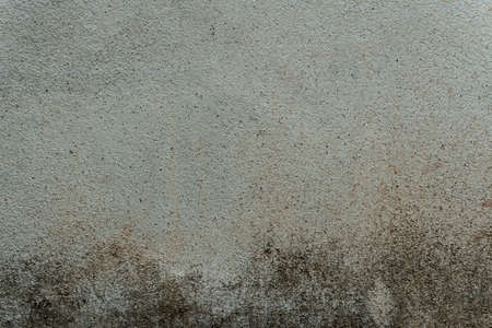 Rough surface of a wall concrete. Old dirty concrete wall for backgroundの写真素材