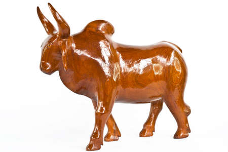 Cow made of wood against white background. の写真素材