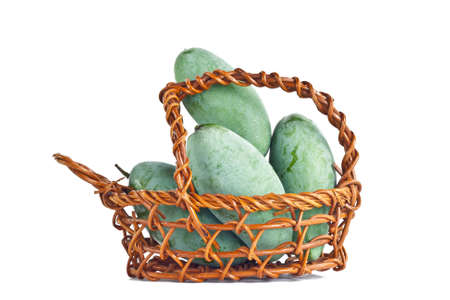 Mangoes in the basket on whiteの写真素材