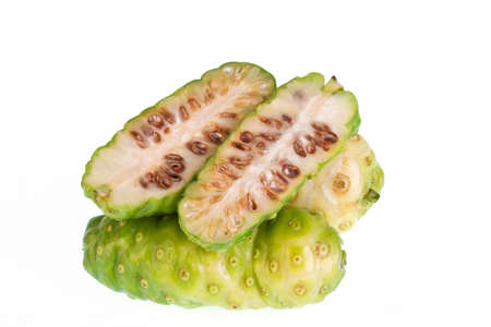 Noni fruits on white isolated background の写真素材
