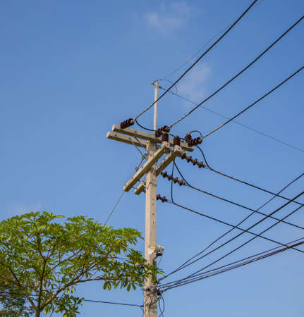 electricity post in blue sky background の写真素材