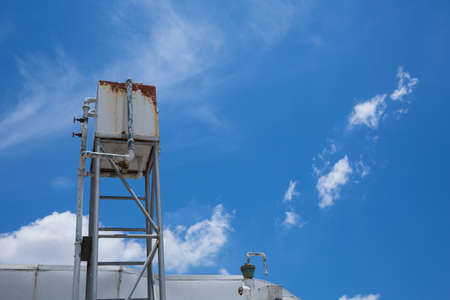 Old Water Tank air conditioner and sky blue  