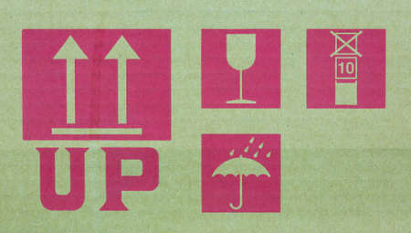 Fine image close-up of fragile symbol on cardboard.の写真素材