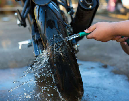 close up washing a motorcycle wheel.の写真素材