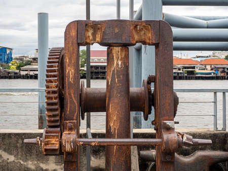 Rusty and metallic gear wheel, part of old boat winchの写真素材