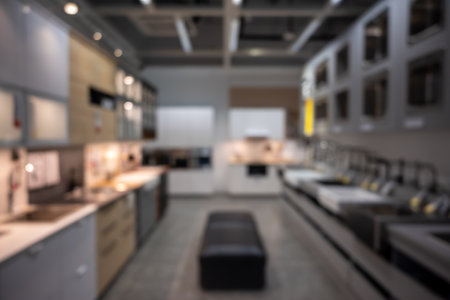 Scenic of modern kitchen abstract defocused blurred background furnished with stove, counter, compartment and kitchenware. Copy space for advertisement wording, website background.の写真素材