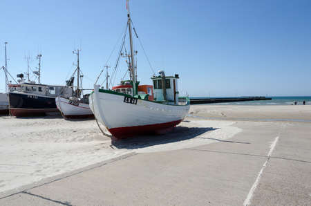 A few fishingboat on land waiting for fish
