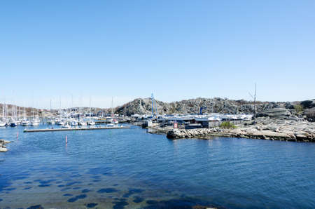 entrance to Saltholmen smbtshamn an early vrdag with many boats remained on landの写真素材