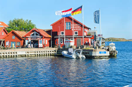 one small place on swedish westcoast many boat and restarangのeditorial素材