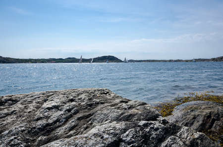 swedish westcoast with boat and sunshine and blue skyの写真素材