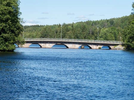 old stonebridge over the lake no cars on the bridgeの写真素材