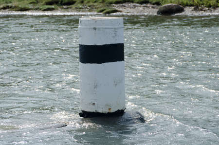 one navigation mark in the water to help to drive the boat safe