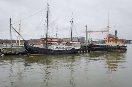 two old boat on the pier in the harbour in Gothenburgのeditorial素材