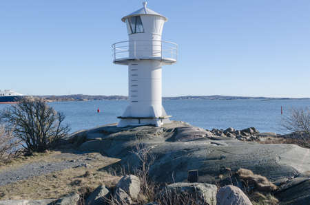 one lighthouse on sweden west-coast standing on a cliffの写真素材