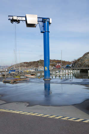 a big crane to lift the boat from the waterの写真素材