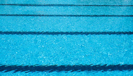 swimming pool with blue water, lane of raceの写真素材