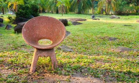old stone chair in the garden, relaxationの写真素材