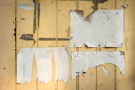 tear blank paper on old wood board for backgroundの写真素材