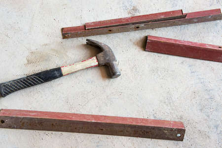 hammer and angle steel on concrete floorの写真素材
