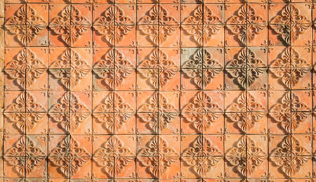 art of flower tiles on the wall facadeの写真素材