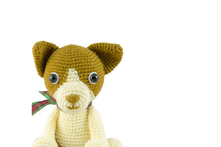 dog doll crochet isolated on white backgroundの写真素材