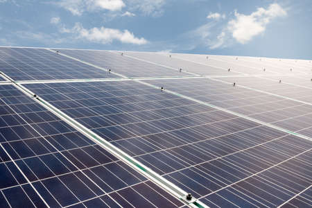 solar cells with blue sky and cloud