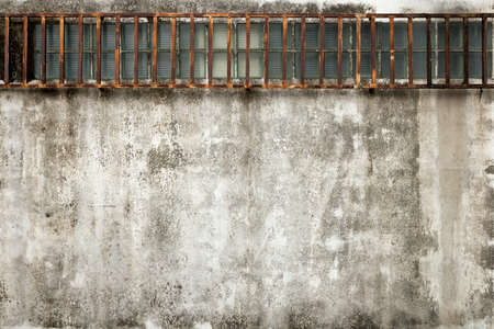 rough and dirty  concrete wall with stain of lichen and mold, backgroundの写真素材