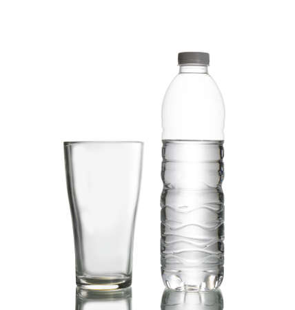 bottle of water and empty glass isolated on white background, clipping pathの写真素材