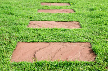 stone walk way on green grass, abstract backgroundの写真素材